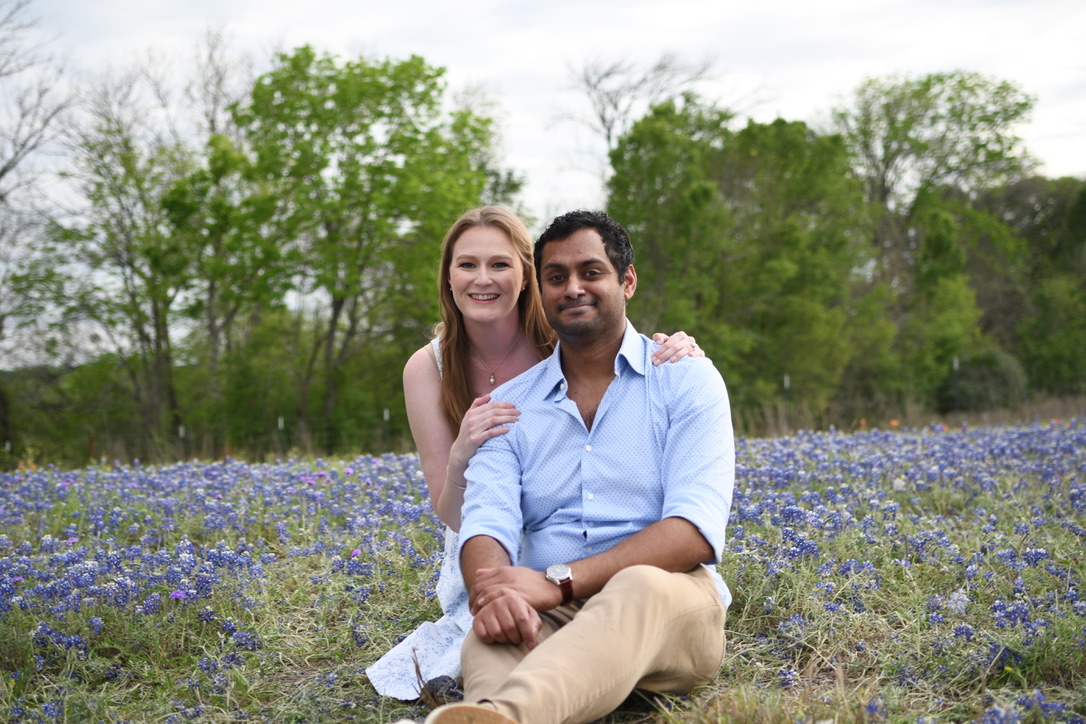 Surya and Leslie in a field of Texas bluebonnets